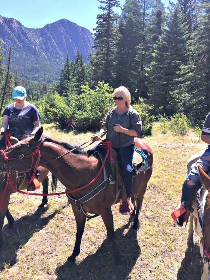 Girls riding horses in the mountains
